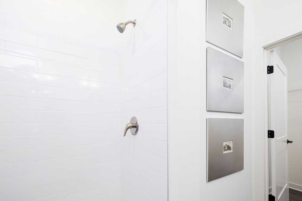 Shower with white subway tile